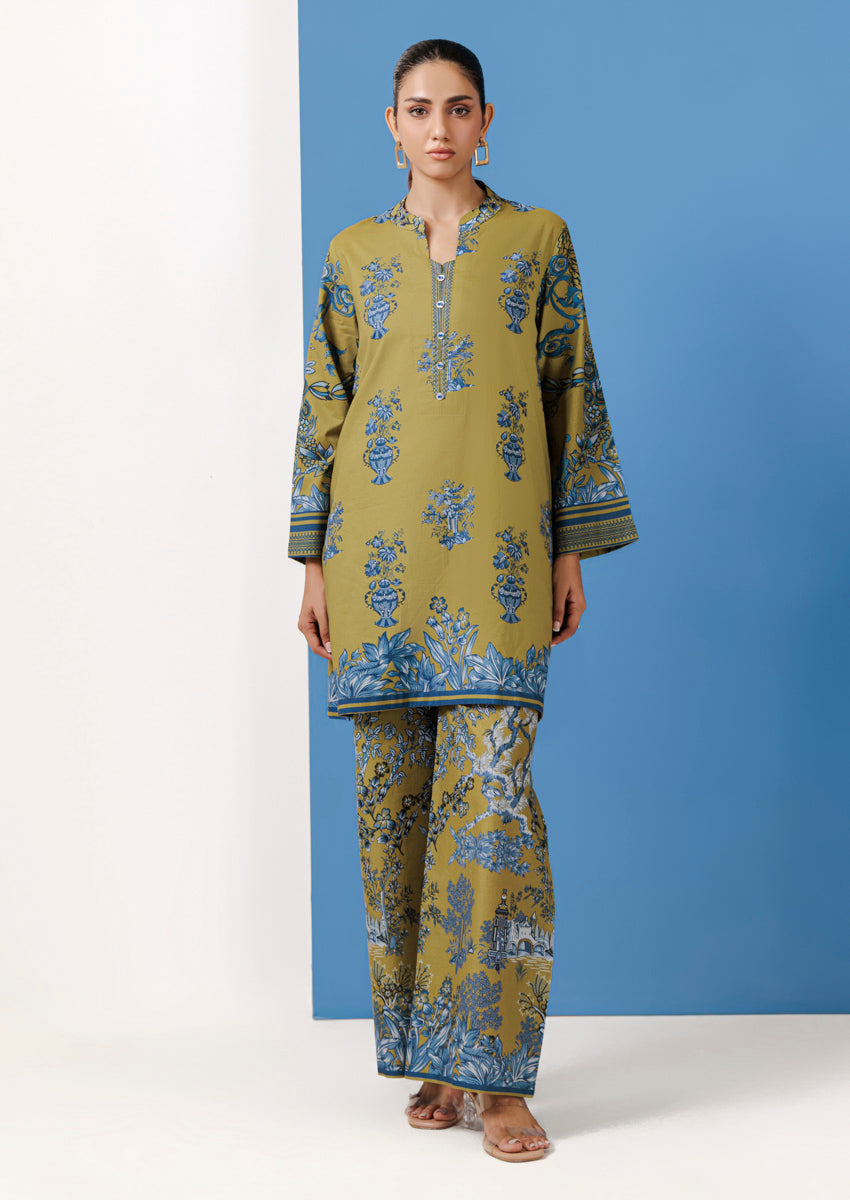 Summer lawn suits in bright colors — pink, green, yellow, and blue — displayed on mannequins and models, showcasing Pakistani summer fashion for 2026