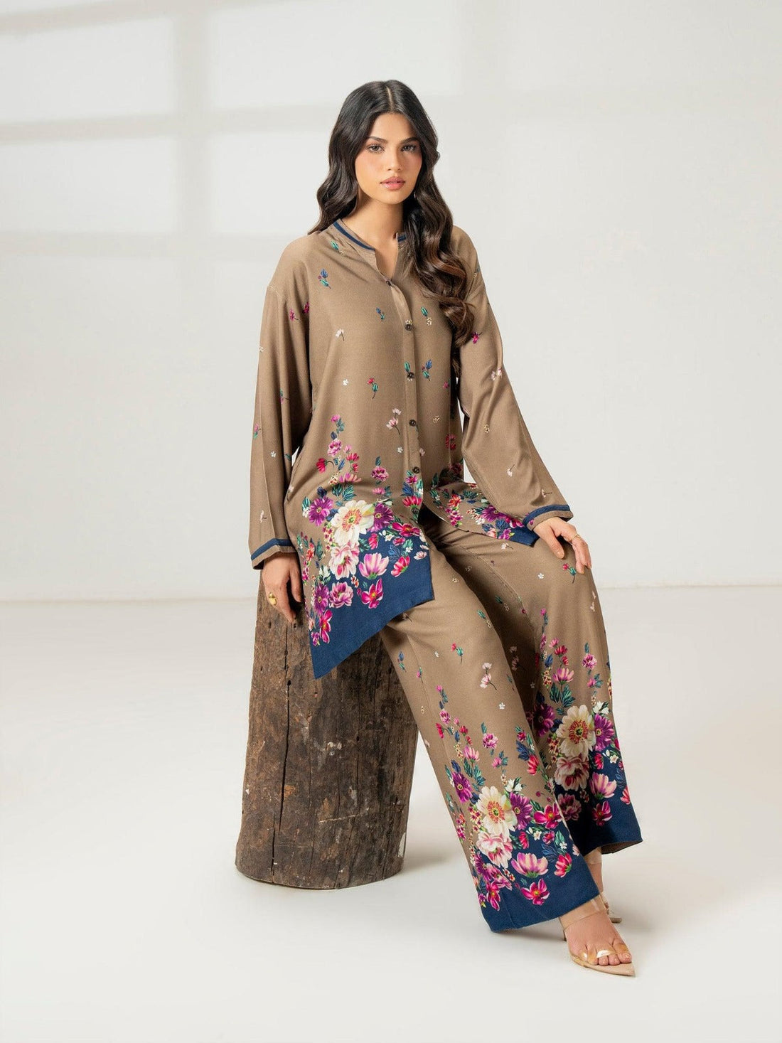 Modern Pakistani suit styled for office wear with neutral tones and tailored trousers