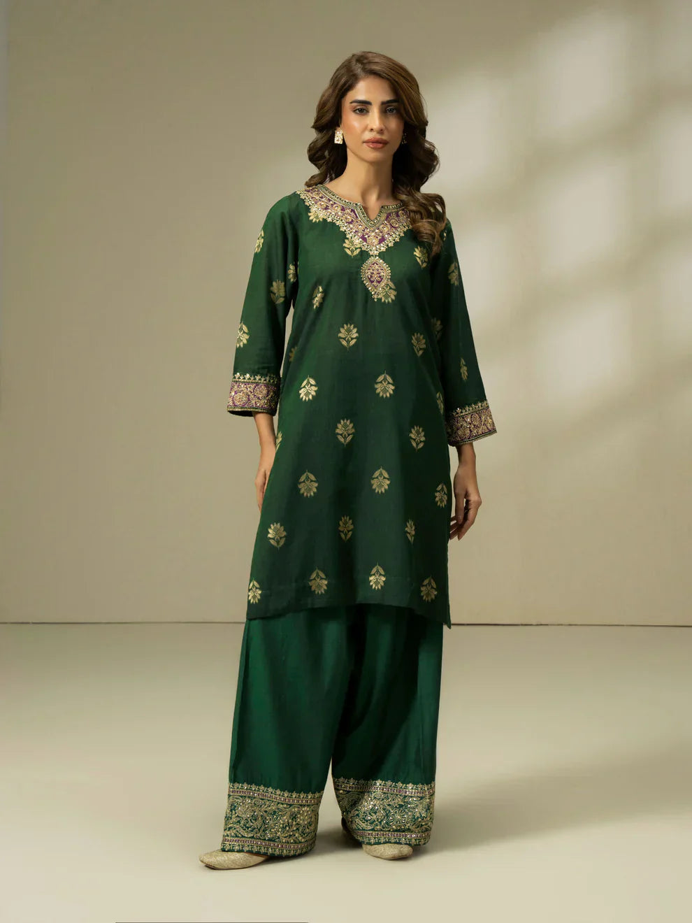 South Asian woman wearing a Pakistani velvet suit while shopping in London — representing modern Pakistani fashion in the UK