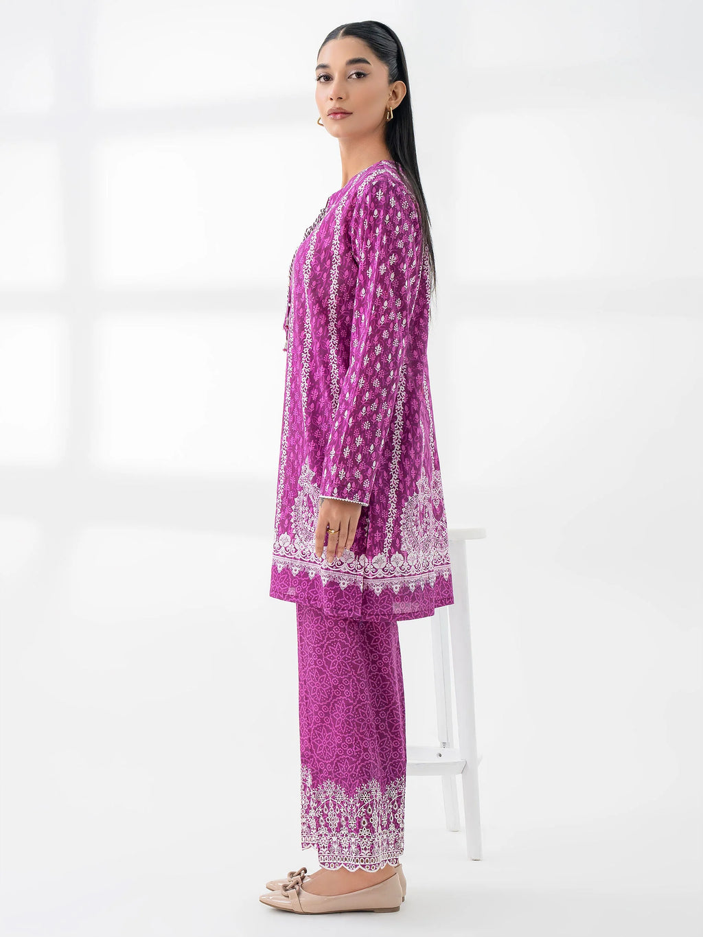 Woman wearing a limelight pink lilencoord set from limelight pakistani salenmore sizes S to L