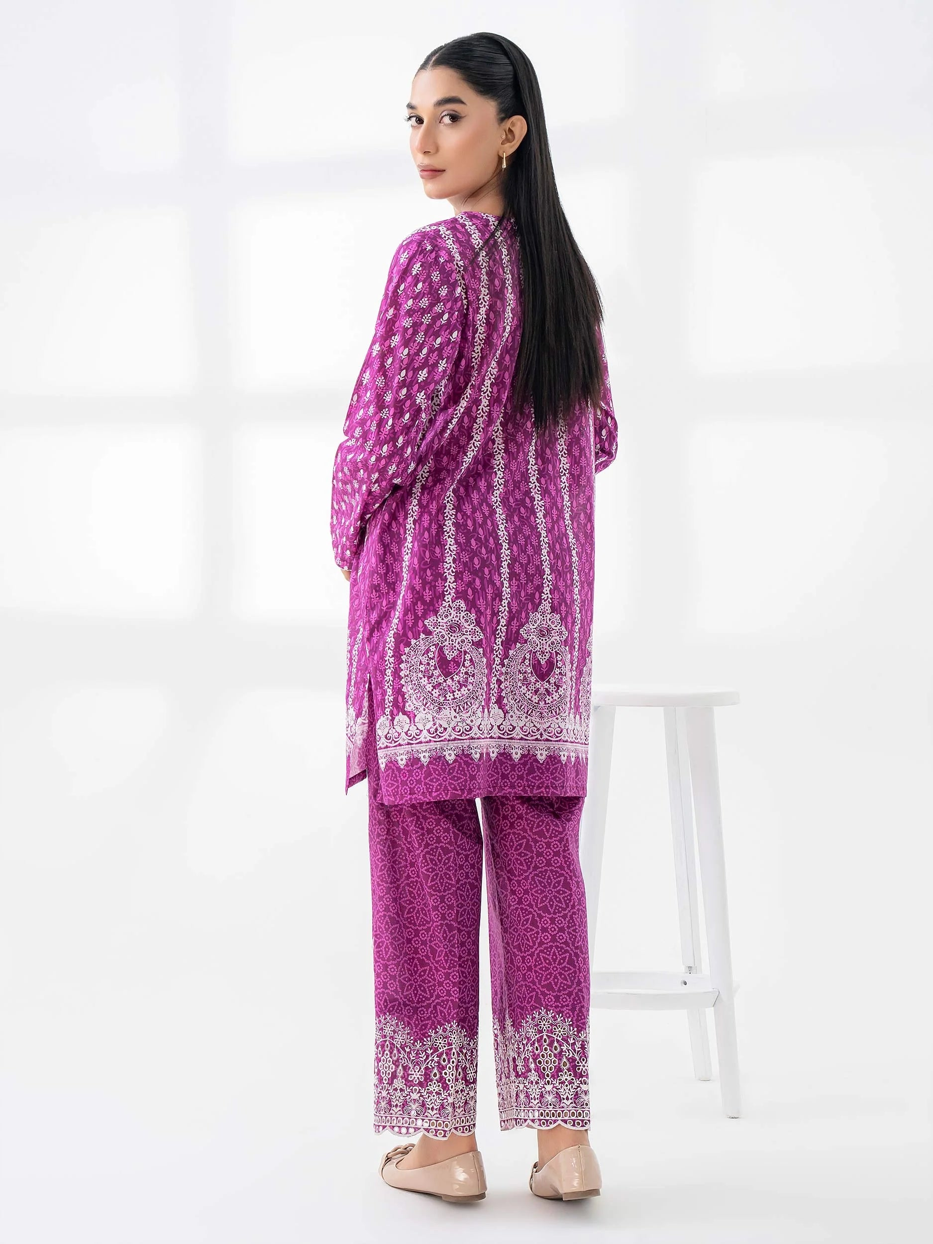 Woman wearing a limelight pink lilencoord set from limelight pakistani salenmore sizes S to L