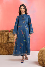 Woman wearing a maria b blue printed A-line dobby viscose shirt with floral patterns, band collar, wide sleeves, and matching straight trousers