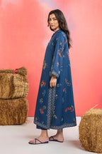 Woman wearing a maria b blue printed A-line dobby viscose shirt with floral patterns, band collar, wide sleeves, and matching straight trousers