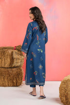 Woman wearing a maria b blue printed A-line dobby viscose shirt with floral patterns, band collar, wide sleeves, and matching straight trousers